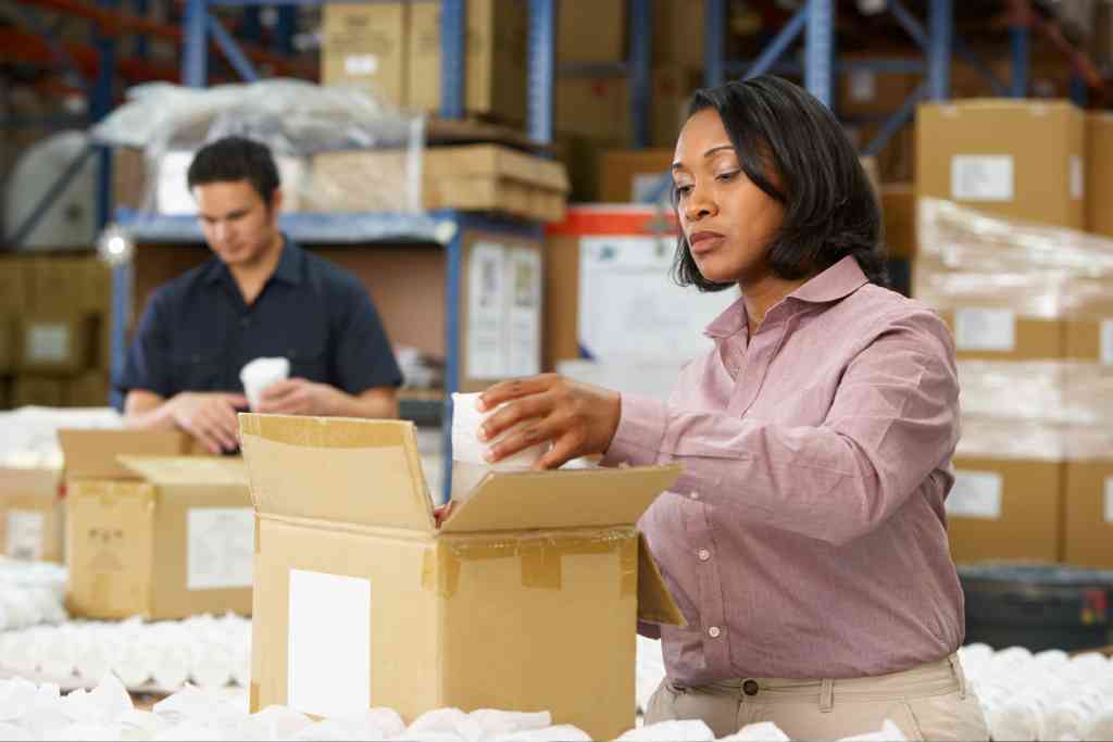 Woman carrying out quality control in warehouse