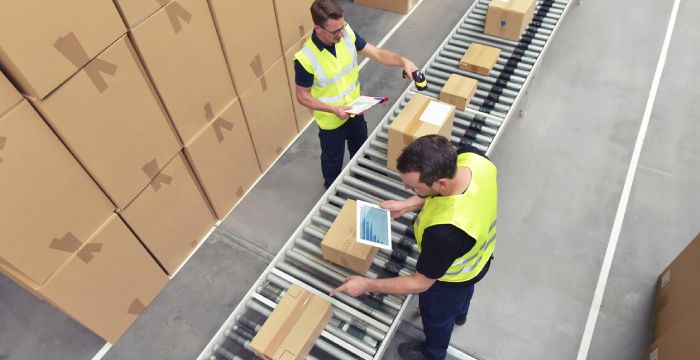 Warehouse team scanning returns